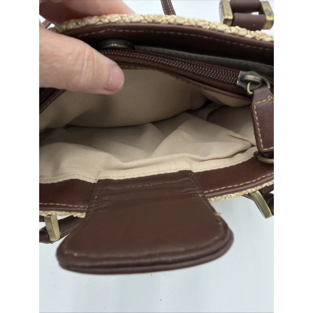 Rosetti straw tote handbag with brown faux leather trim‎ and top handles.